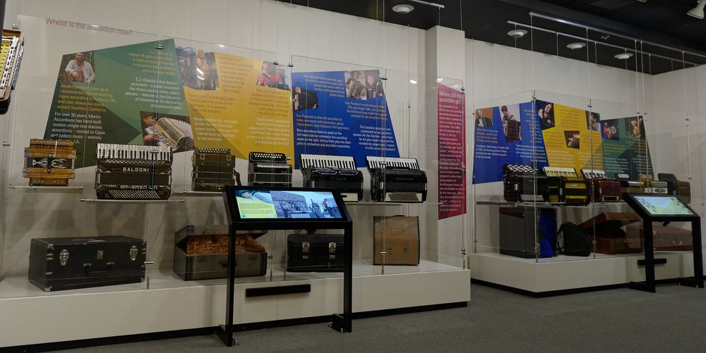 Exhibition display featuring variety of colorful accordions