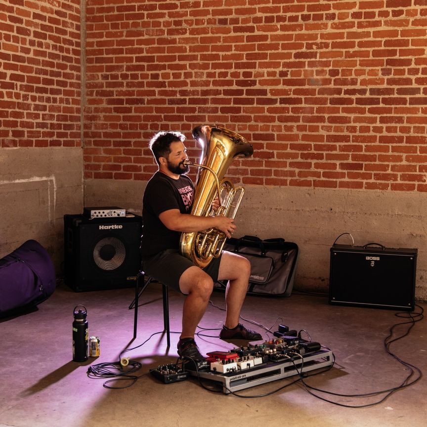 Jonathan Piper with tuba, pedalboard, and amplifier